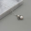 Cadena de plata 9.25 y dije ángel con perla cultivada