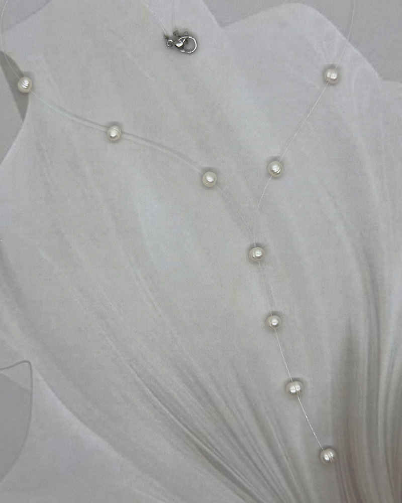 Collar 1 linea polimero sintetico y corbata de perlas cultivadas