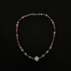 Collar seguido de perlas de colores y perla blanca de 12mm