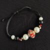 Pulsera ajustable colores rojo, negro y blanco