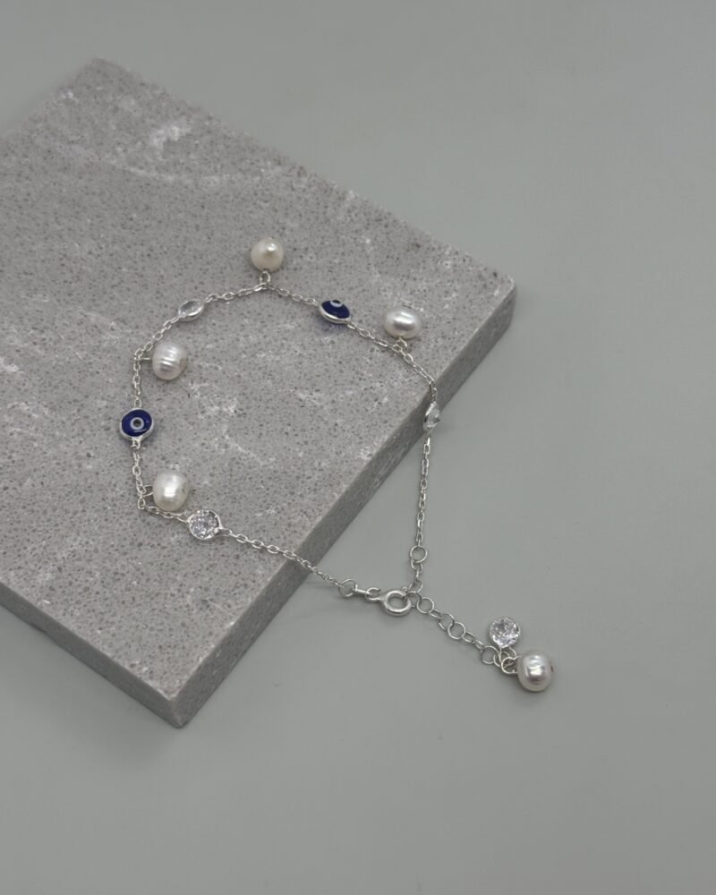 Pulsera de plata 9.25 con perlas cultivadas y ojos turcos