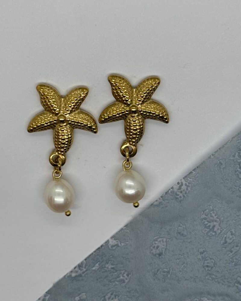 Arete de estrella de mar en acero inoxidable con perlas cultivadas